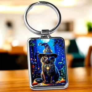 Porte-clé illustré d'un chat noir coiffé d'un chapeau de sorcier dans une nuit magique, dessin artisanal chat sorcier